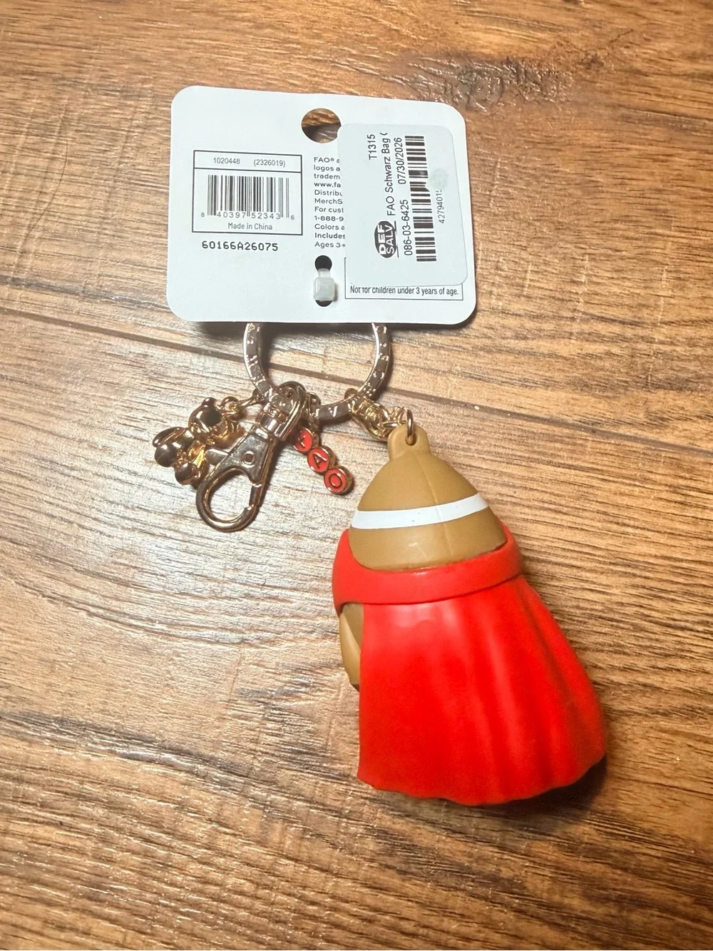 FAO Schwarz Red & Brown Superhero Football Bag Charm Keychain